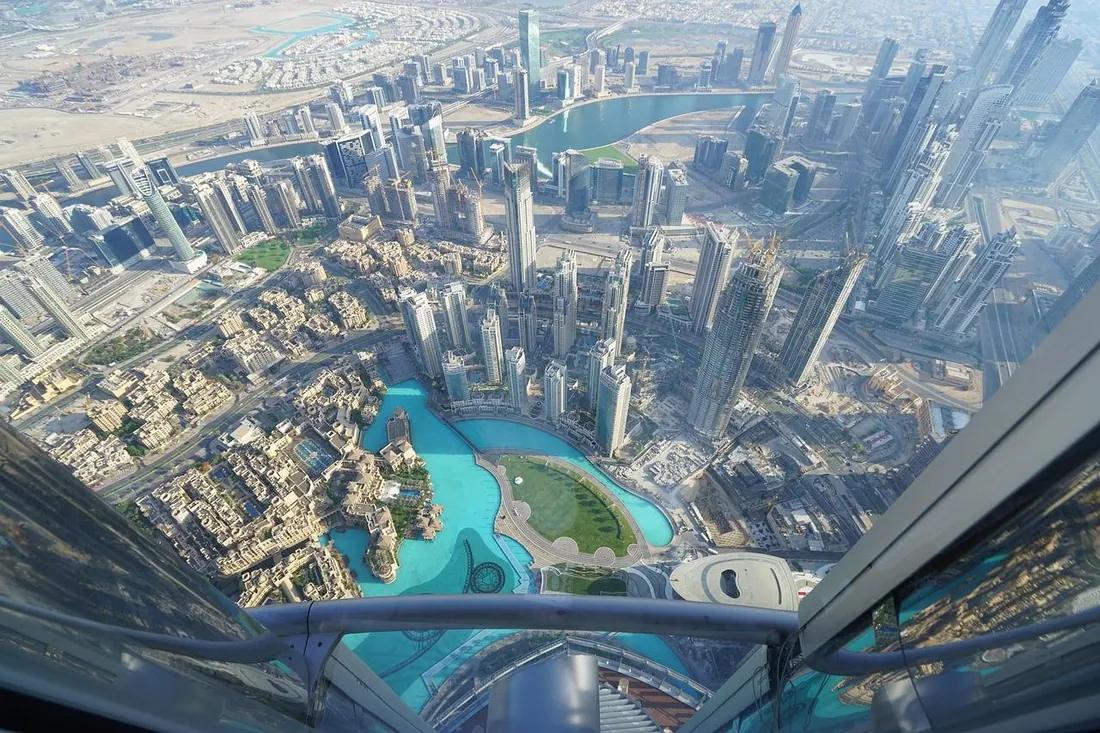 View straight down from the Burj Khalifa observation deck over Burj Lake and Downtown Dubai